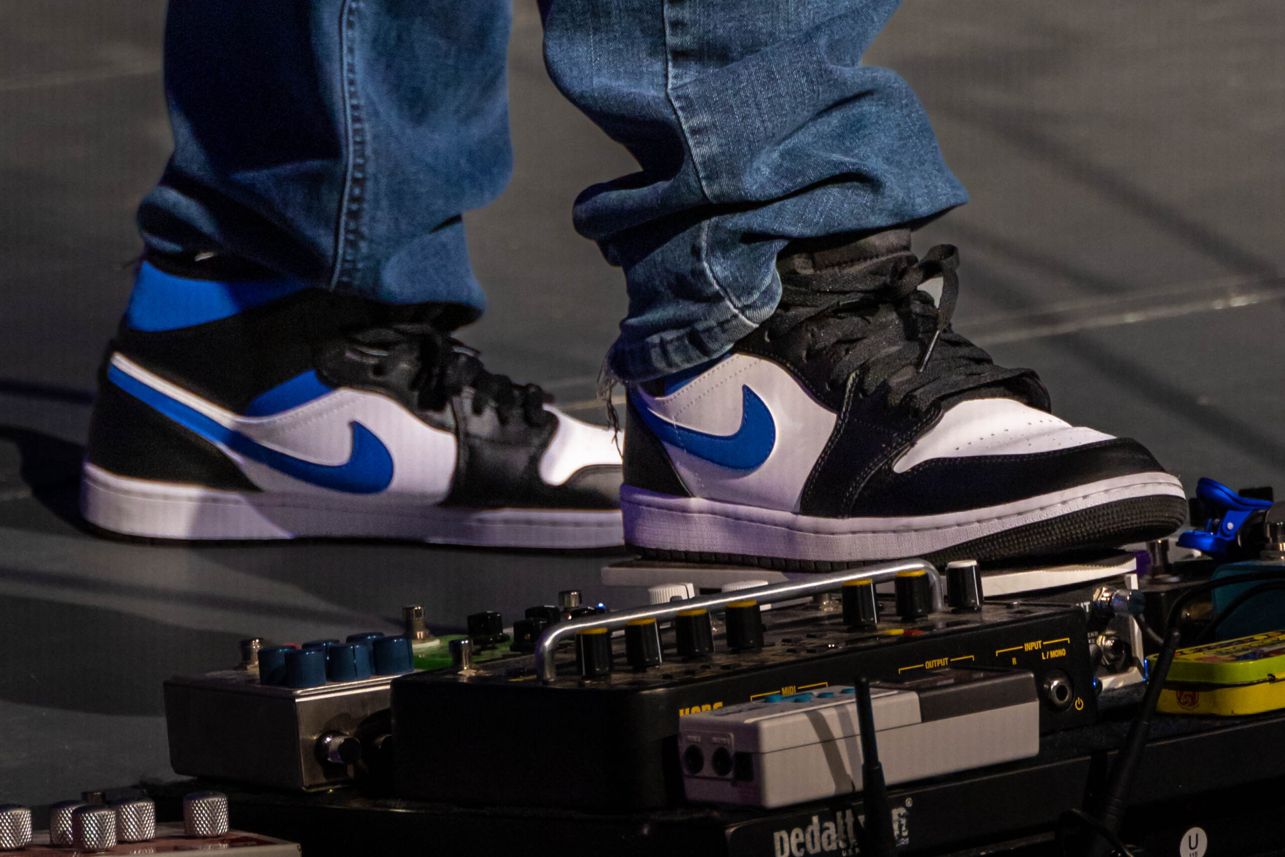 group of people sitting on ground with bonfire